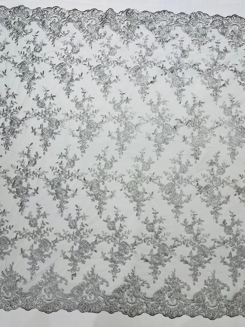 Corded embroider flowers on a mesh lace fabric-prom-sold by the yard.